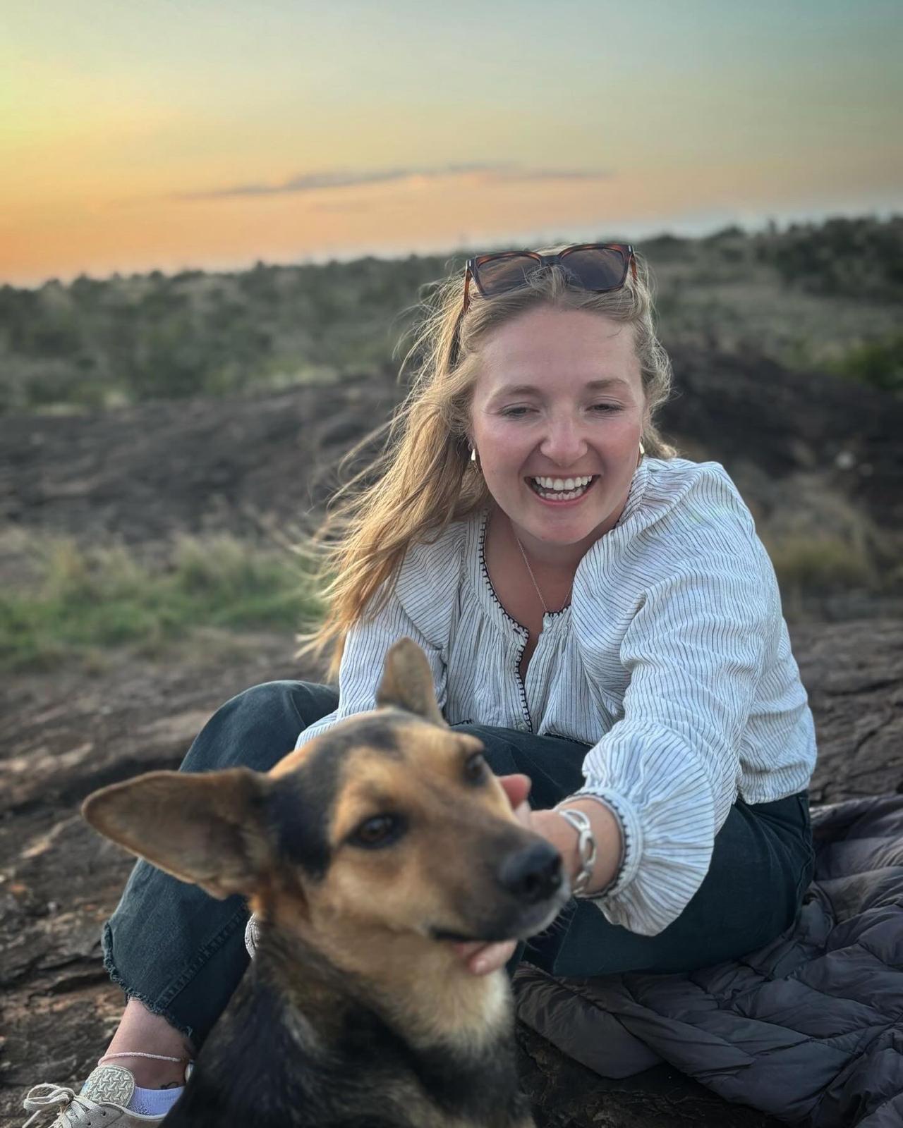 Tor, Daisy & Dogs sitter, sitting with a dog at sunset